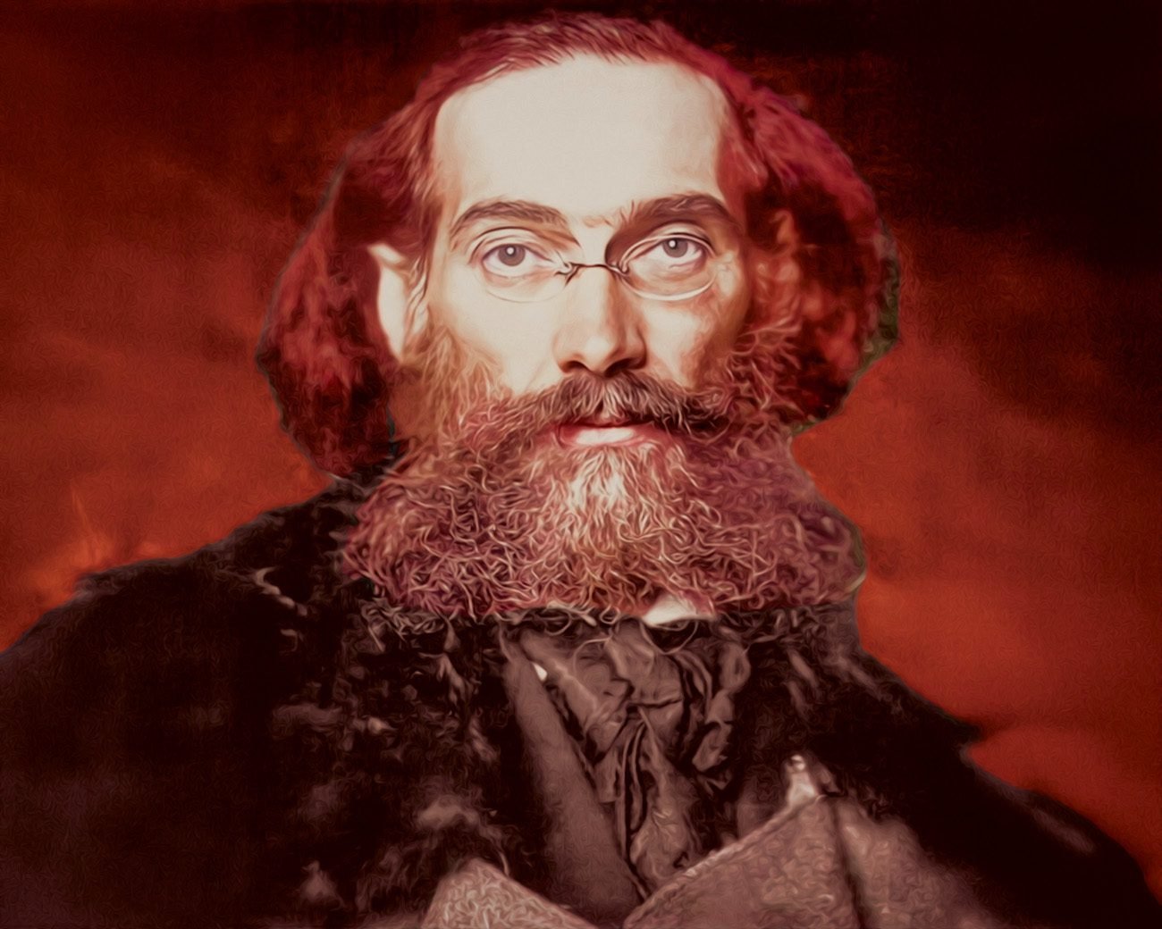 Portret van Gustav Landauer rond 1910 met bril en volle baard, kijkend recht in de camera.